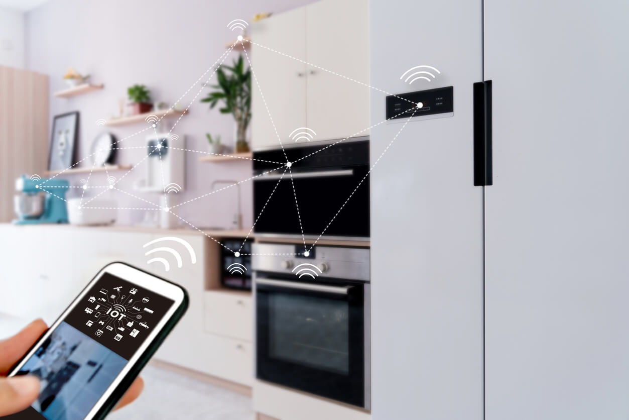 Customer using IoT connected Kitchen Appliances with phone