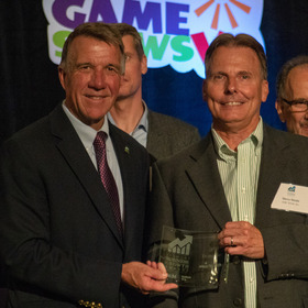 ASIC North Employees Accepting Trophy