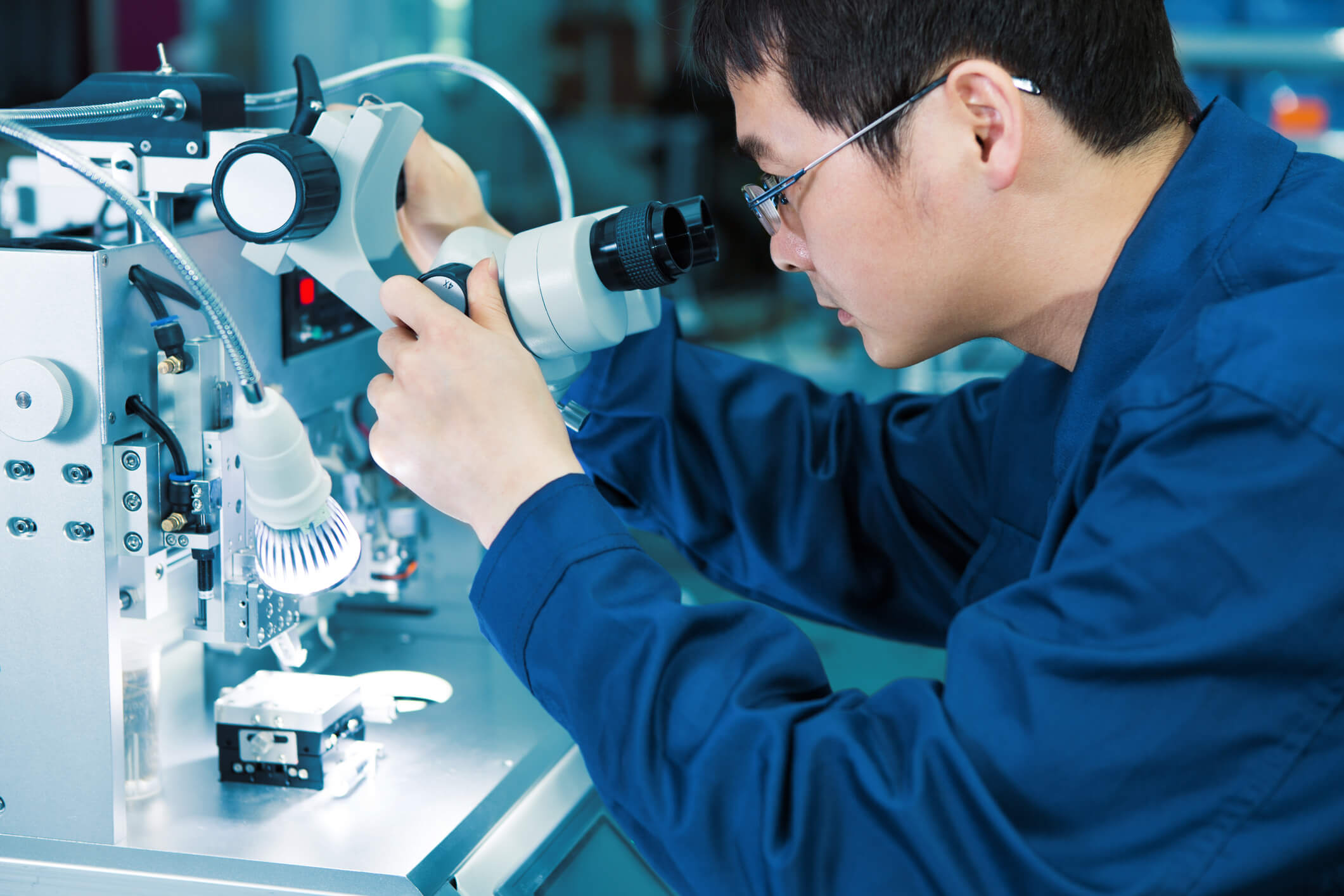 Man looking at a microscope