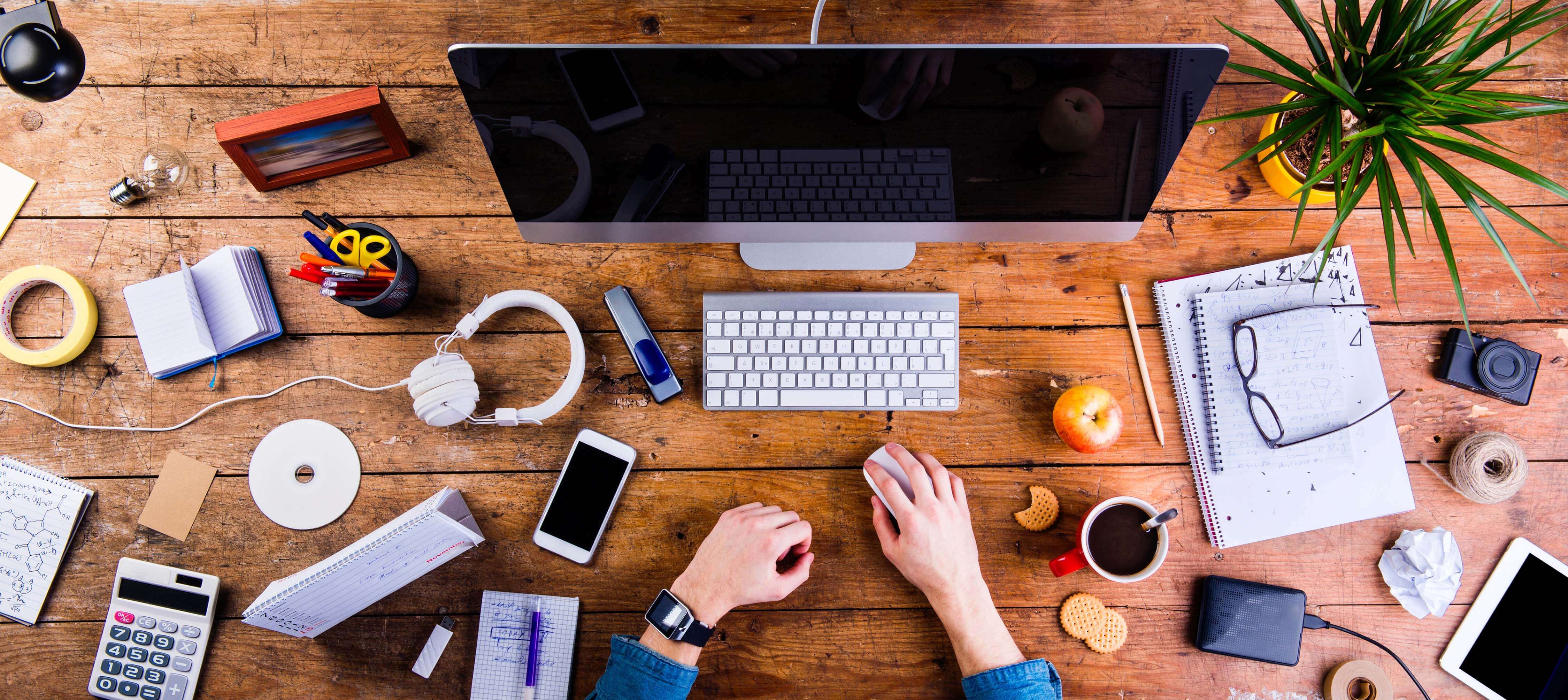 person sitting at messy desk